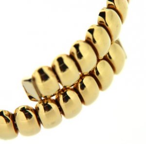 Bracciale rigido in oro giallo con ovalini lucidi